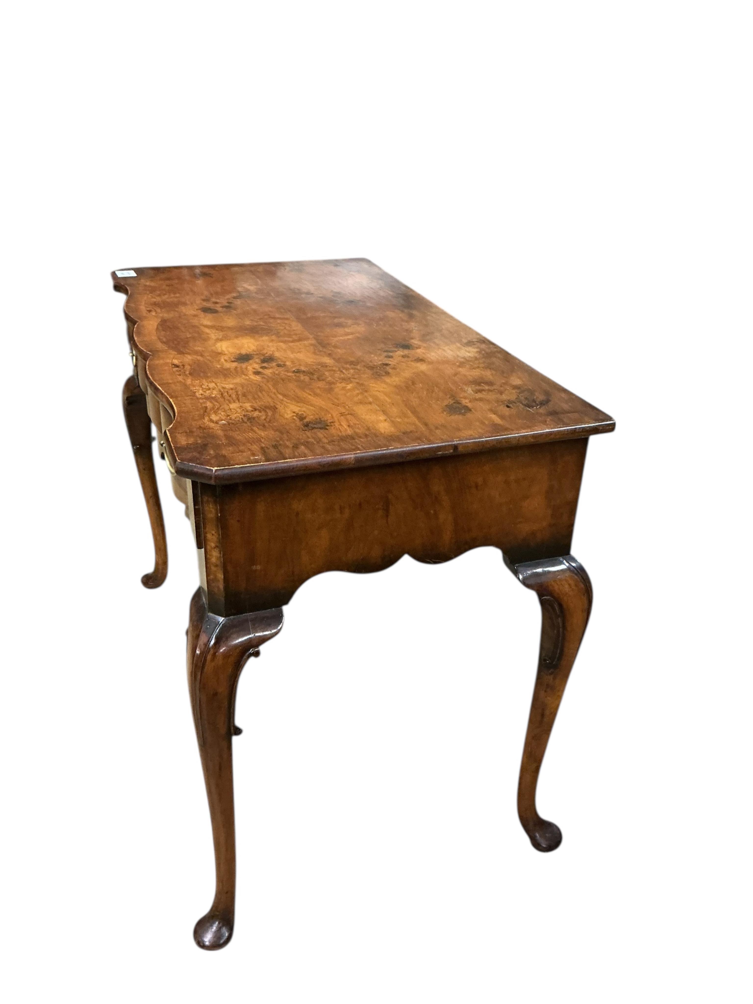 A Queen Anne Revival banded walnut side table, width 90cm, depth 51cm, height 72cm together with a similar stool
